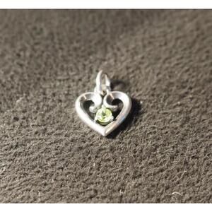 James Avery Remembrance Heart Charm featuring a peridot stone